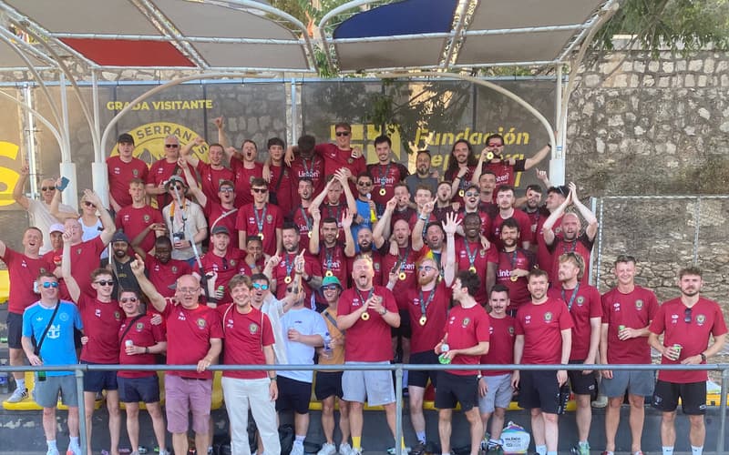 VMFC players celebrating with gold medals in Valencia